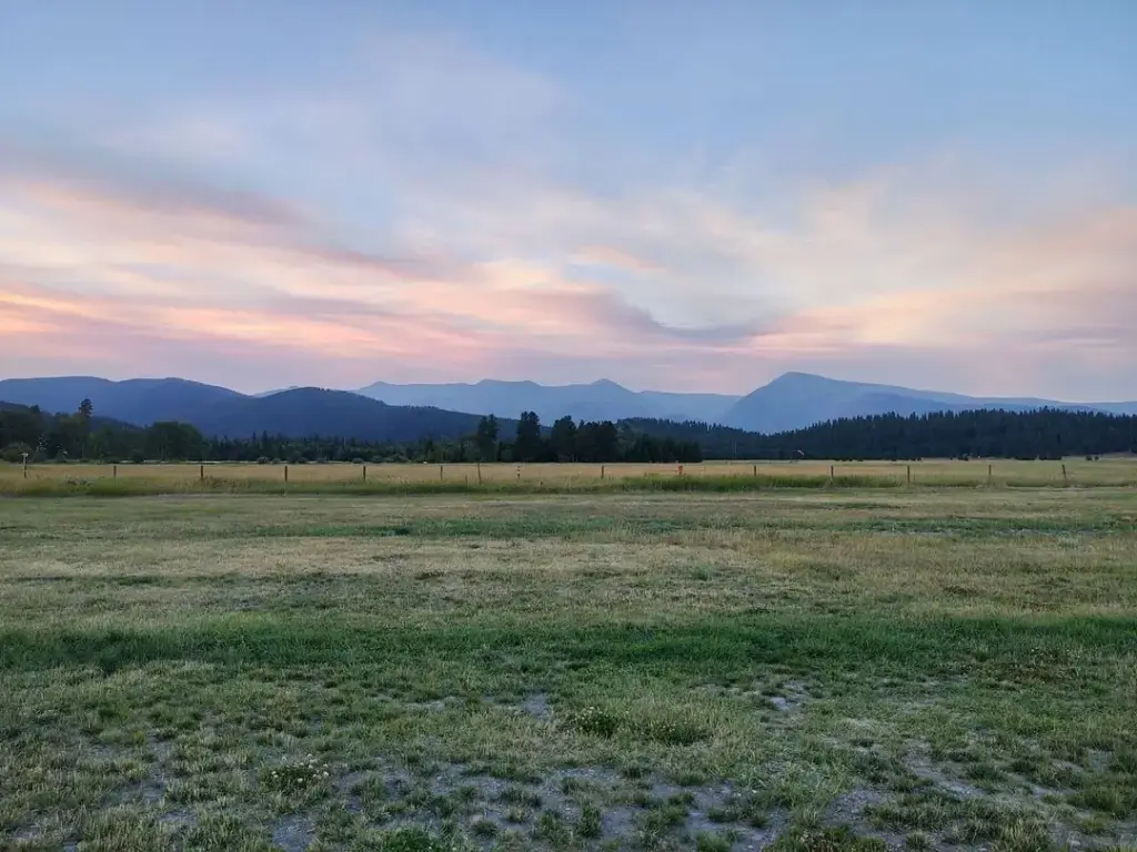 Open meadow below the mountains near Lincoln, Montana